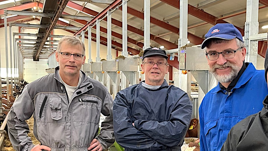Photo of Erlend Hynne, Jan Atle Bakkenget and Hans Snerting inside a barn.