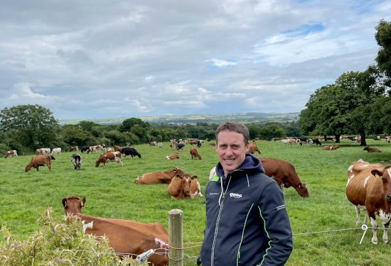 Vegard Smenes in front of Norwegian Red cows at Dunne farm